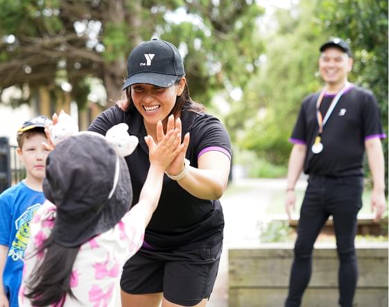 Teacher high-fiving student
